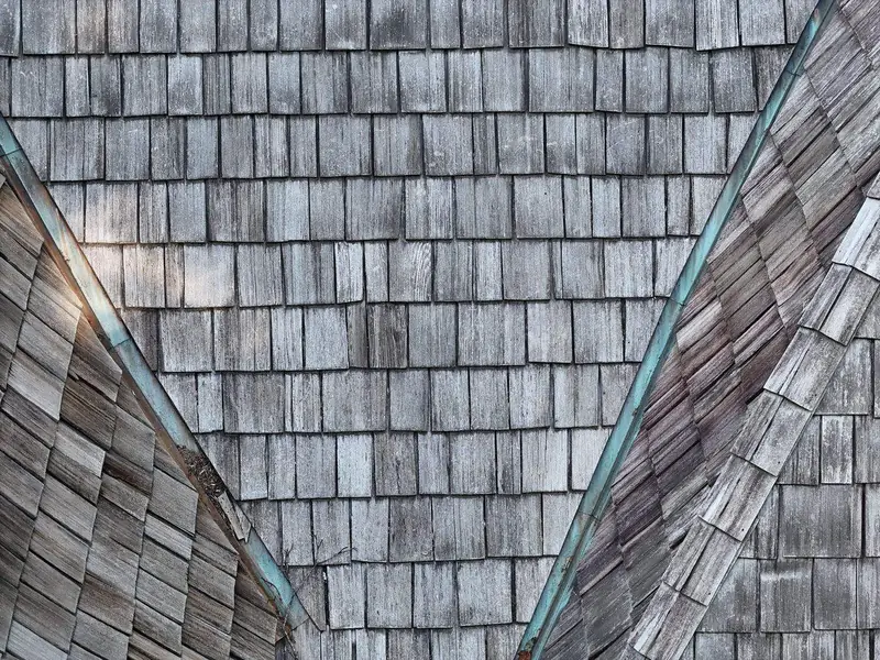 Before: weathered cedar shake roof in Raleigh, NC before replacement