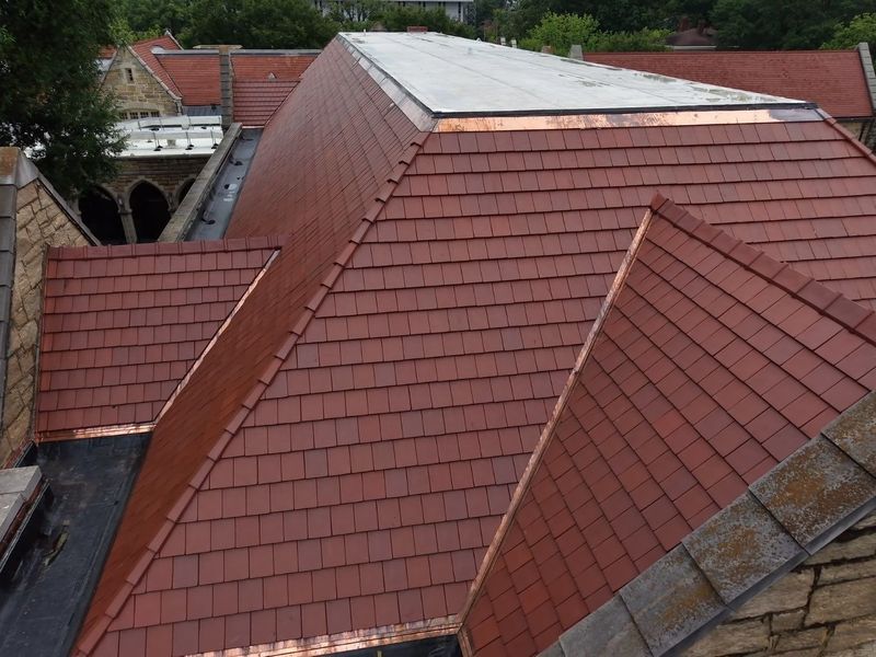 Ludowici clay tile roof with copper by Cadmus Construction in North Carolina